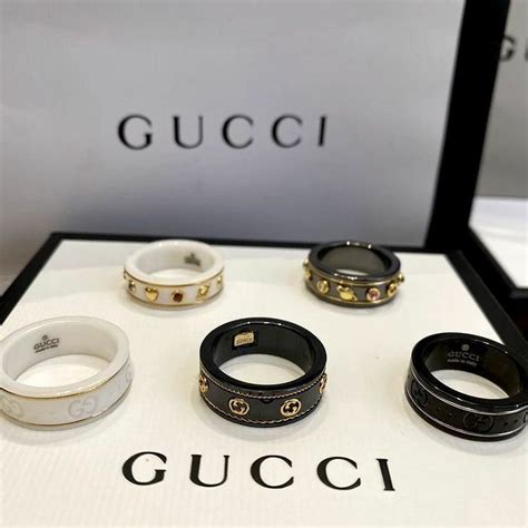 gucci icon ring with gemstones.